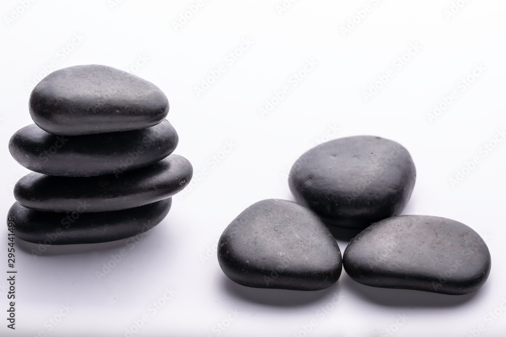 Black stone composition close up on white background Black stone composition close up on white background