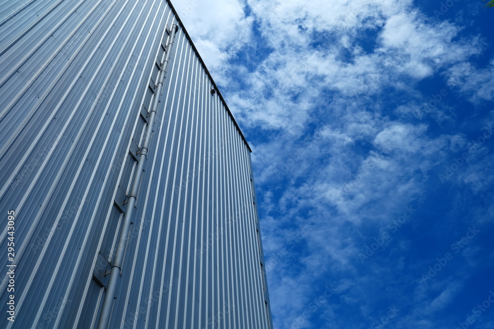 Warehouse Wall with Blue Sky Background. Warehouse Wall with Blue Sky Background.