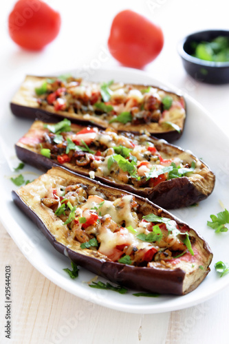 Eggplants stuffed with meat, mushrooms and tomatoes
