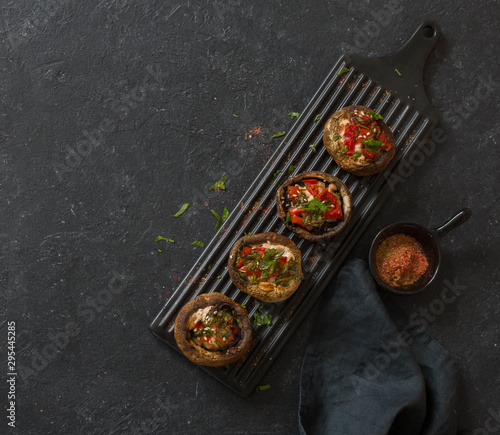 Mushrooms filling with tomatoes, sweet peppers and chicken