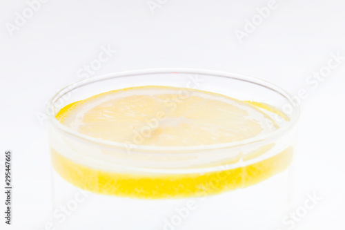 Slice of lemon in the glass isolated on the white