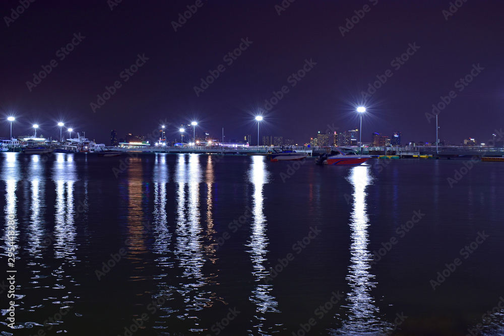 Pattaya Pier At night there is a beautiful light. And there are many boats Waiting for tourists at night Pattaya Pier At night there is a beautiful light. And there are many boats Waiting for tourists at night