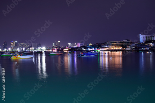  Pattaya Pier At night there is a beautiful light. And there are many boats Waiting for tourists at night