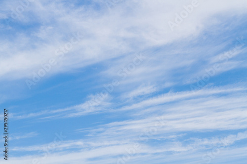 White fluffy clouds in the blue sky in summer