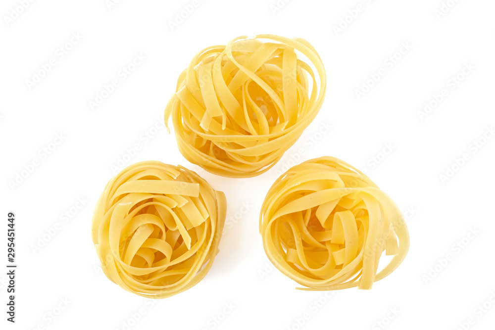 Italian rolled Raw noodles. Pasta isolated on white background . Egg homemade dry ribbon noodles, long rolled macaroni or uncooked spaghetti isolated. Italian rolled Raw noodles. Pasta isolated on white background . Egg homemade dry ribbon noodles, long rolled macaroni or uncooked spaghetti isolated.