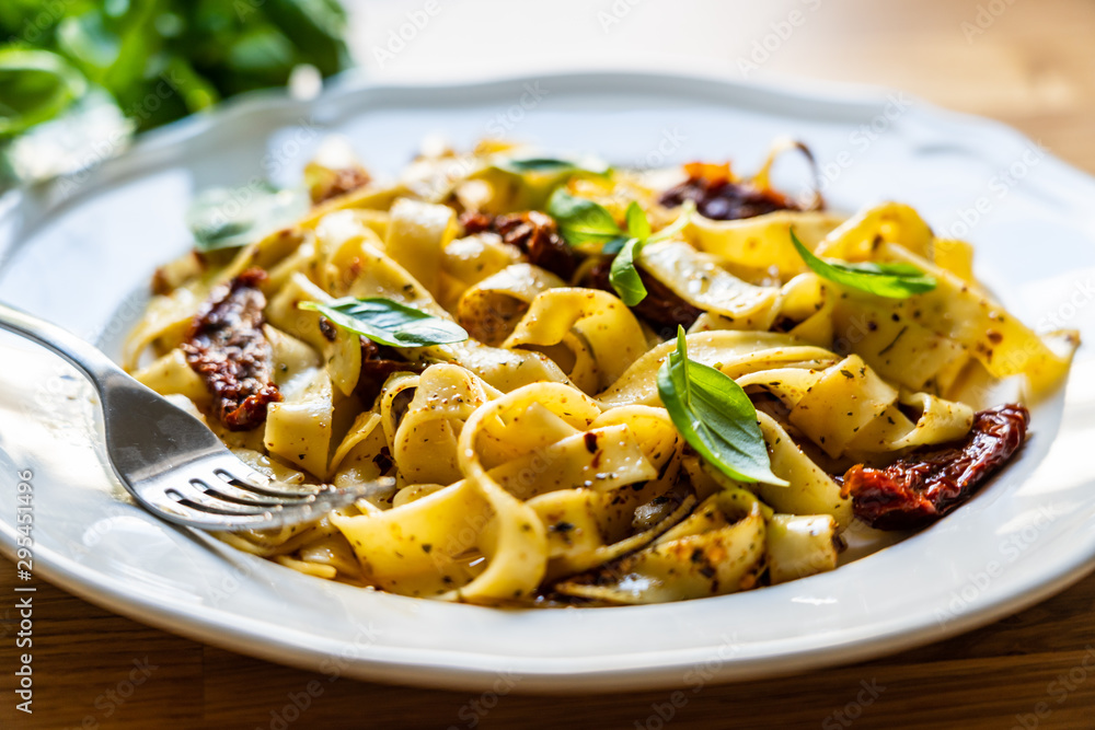 Pasta with sauce and sun-dried tomatoes Pasta with sauce and sun-dried tomatoes