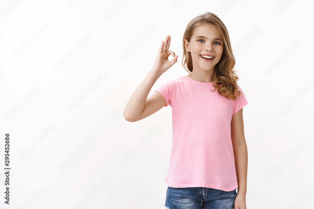 Okay I agree. Cute charming young little kid, girl accept friend idea, show ok approval gesture and smiling pleased, playfully having fun with children playground judging cool toy, white background Okay I agree. Cute charming young little kid, girl accept friend idea, show ok approval gesture and smiling pleased, playfully having fun with children playground judging cool toy, white background