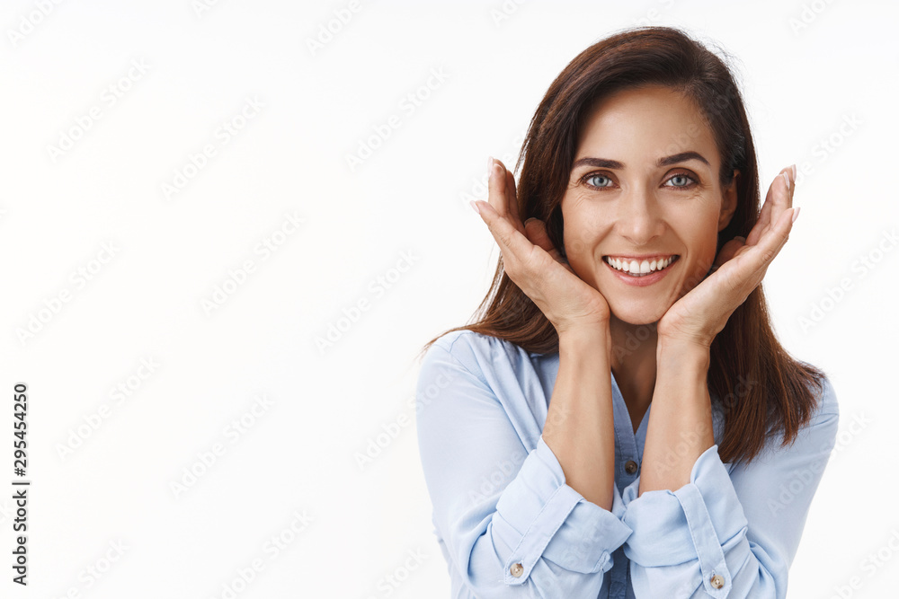 Pretty flirty good-looking adult woman with tattoo, show facial blemish, feeling pretty, delighted clean good skin condition, hold hands jawline, smiling tender relaxed, pleased skincare product Pretty flirty good-looking adult woman with tattoo, show facial blemish, feeling pretty, delighted clean good skin condition, hold hands jawline, smiling tender relaxed, pleased skincare product