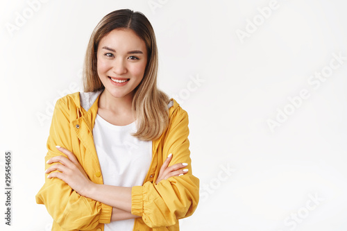 We can deal together. Cheerful cute supportive asian charismatic girl smiling delighted toothy white perfect smile cross arms chest look camera assertive determined aim success, white background
