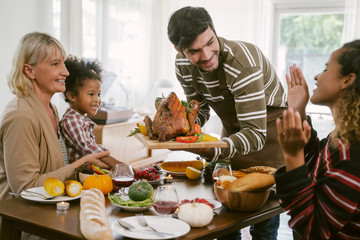 Happy Family Celebrating Thanksgiving Dinner at home . Celebration tradition concept
