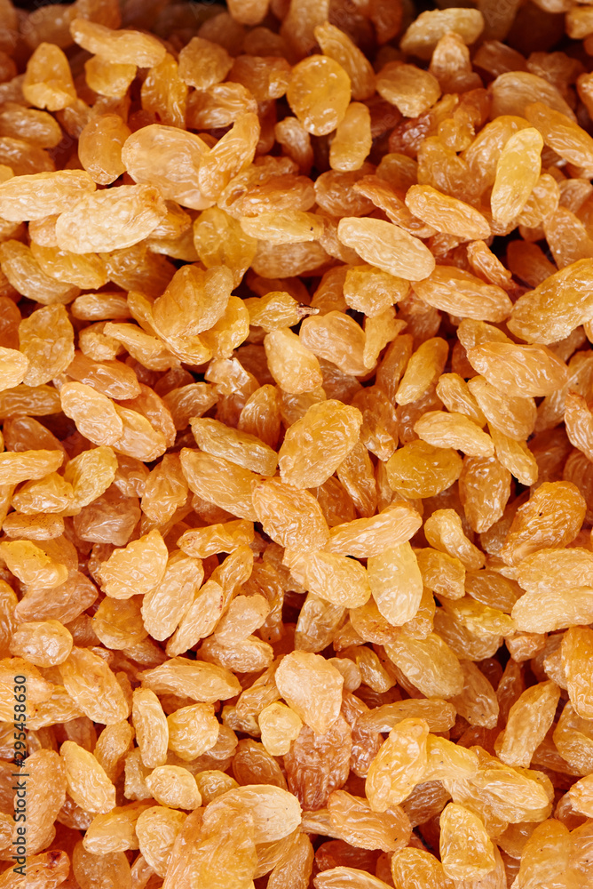 Background of yellow raisins close-up Background of yellow raisins close-up