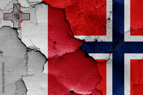 flags of Malta and Norway painted on cracked wall