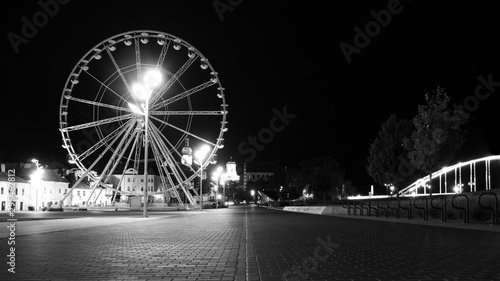 a ferris wheel in downtown Gyor b w