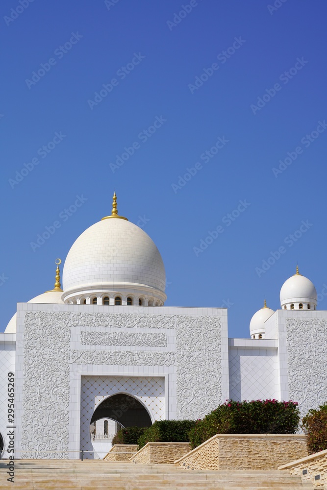 low angle view on sheikh zayed grand mosque by clear blue sky