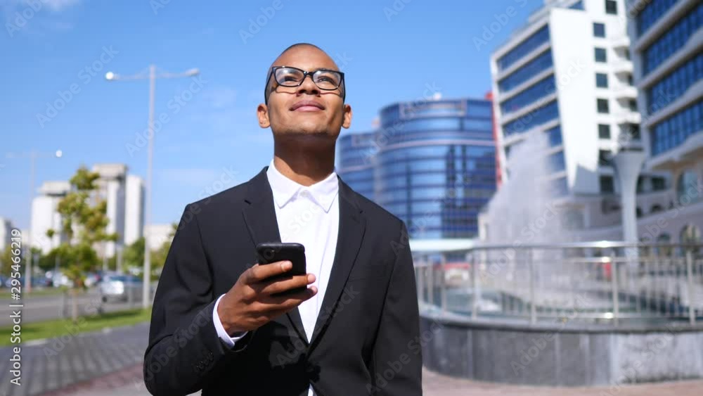 Business, Technology And People Concept. Smiling Businessman With Smartphone Outdoors. Business, Technology And People Concept. Smiling Businessman With Smartphone Outdoors.
