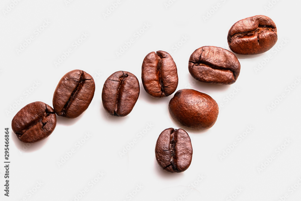 Roasted coffee beans isolated on white background. Roasted coffee beans isolated on white background.