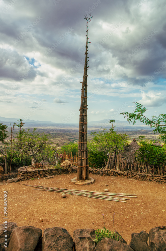 An elevated pole made with several tall trunks, joined and tied with pita ropes in the middle of a square to perform a ceremony in a village in Ethiopia. Travel adventure concep