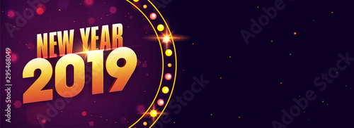 Social media banner with shiny golden text 2019 on purple background for New Year celebration.