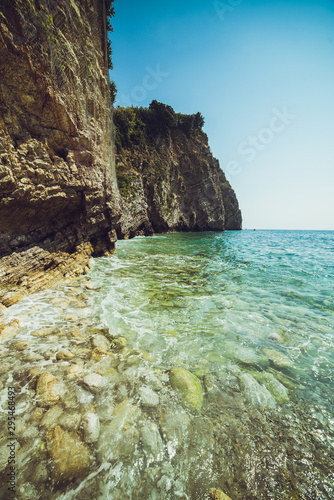 Adriatic coast in summer. The height of the tourist season. Transparent warm sea and mountains. Montenegro.