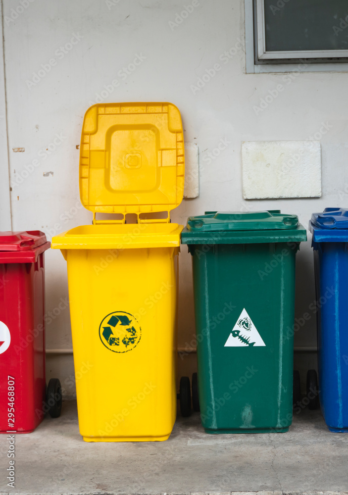 Garbage Trash Bins for collecting a recycle materials. Garbage trash bins for waste segregation. Separate waste collection food waste, plastic, paper and danger waste. Recycling. Environment. Garbage Trash Bins for collecting a recycle materials. Garbage trash bins for waste segregation. Separate waste collection food waste, plastic, paper and danger waste. Recycling. Environment.