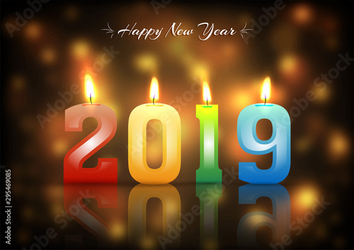 Colorful number candles illuminated on glossy blurred background for New year celebration greeting card design.