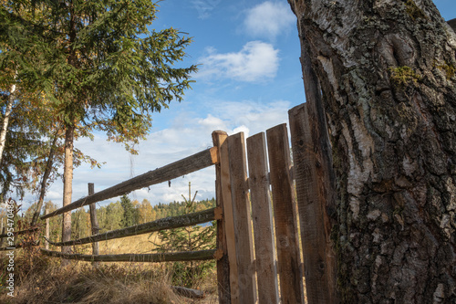 Wooden fence in countryside with beautiful blue sky  and nature in the background