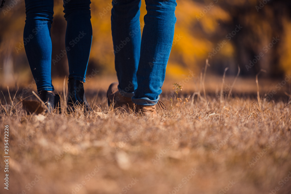 Amorous couple standing on the green grass Amorous couple standing on the green grass
