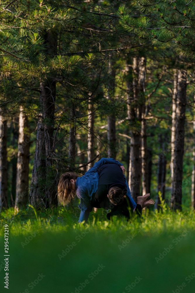The two young girl and boy dancing hip hop in nature The two young girl and boy dancing hip hop in nature