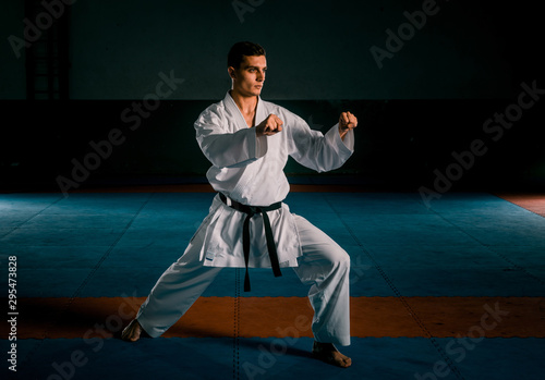 Martial arts master on fight training in gym