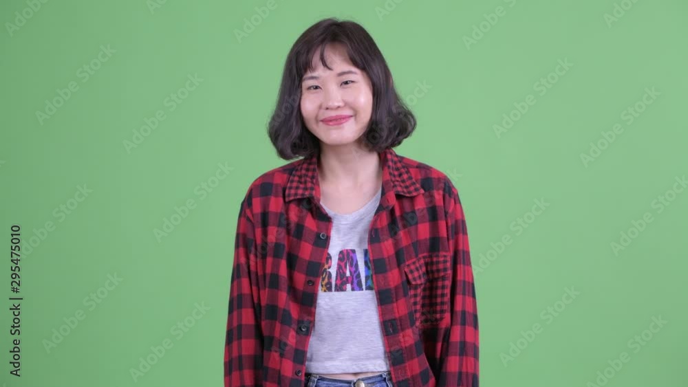 Happy Asian hipster woman smiling