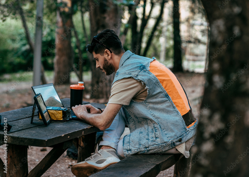 Fototapeta premium Self employed man concentrated while is working with a laptop