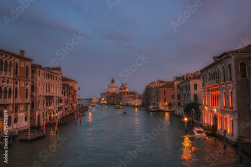 Night view from Accademia bridge on Grand Canal and Santa Maria della Salute cathedral. Venice, Italy.