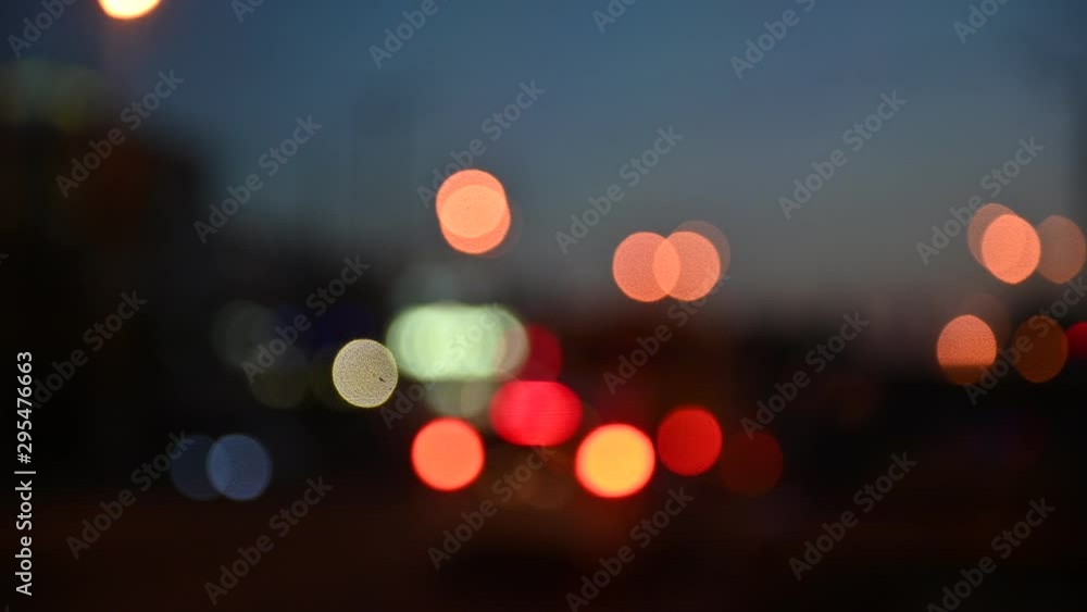 Beautiful glittering bokeh in dark blurry background at night. Beautiful glittering bokeh in dark blurry background at night.
