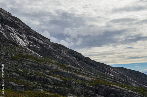 Fototapeta Naklejka Na Ścianę i Meble -  Landscape photo of the trail path to the cliff Trolltunga in the Norwegian mountains.