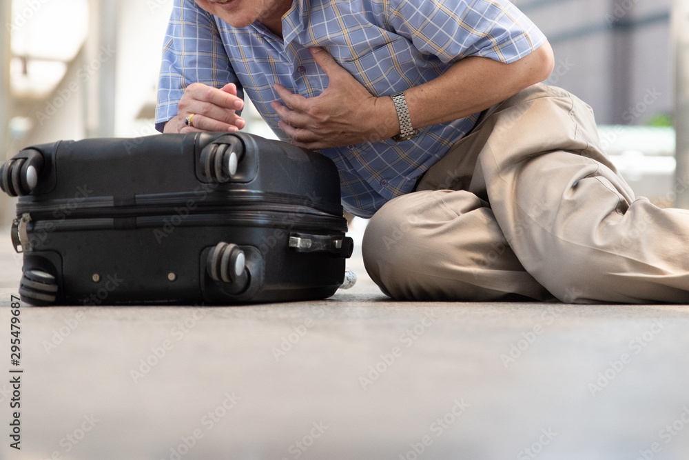 Low Section Of Man With Chest Pain Sitting On Footpath Low Section Of Man With Chest Pain Sitting On Footpath