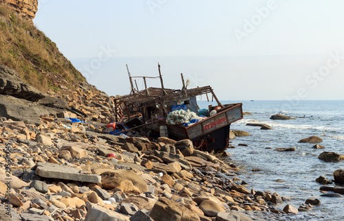 Wooden fishing boat from North Korea, shipwrecked after a storm off the coast of the Russian island, Vladivostok.