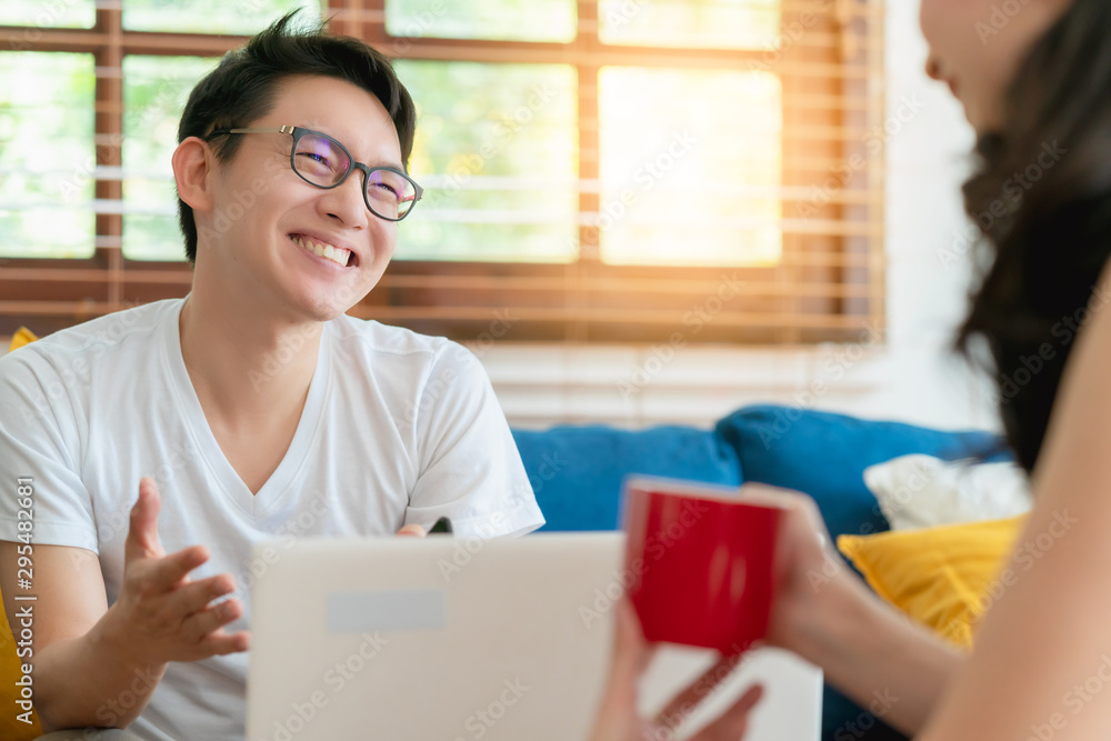 happiness asian couple family marry enjoy morning talk together with love and relation on sofa with laptop and coffee home interior background happiness asian couple family marry enjoy morning talk together with love and relation on sofa with laptop and coffee home interior background