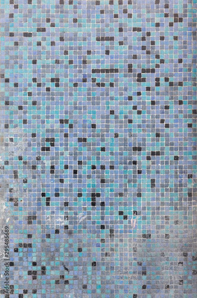Fototapeta premium Close-up of a weathered, dirty and colorful tiled mosaic pattern floor or wall. High resolution full frame textured background.