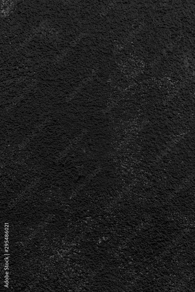 Close-up of a plastered, painted rough wall. Dark high resolution full frame textured background in black and white. Close-up of a plastered, painted rough wall. Dark high resolution full frame textured background in black and white.