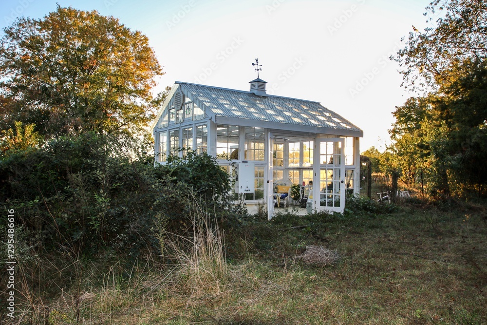 Beautiful Victorian Style Greenhouse built of old recycled windows with a decorated interior with a large soaking tub and stenciled floor Beautiful Victorian Style Greenhouse built of old recycled windows with a decorated interior with a large soaking tub and stenciled floor