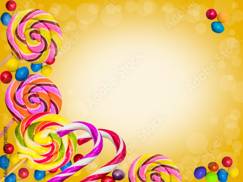 Colorful frame of sweets and lollipops on a bright background.