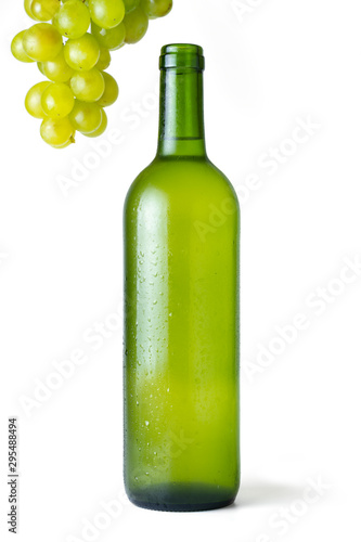 Very cold white wine bottle with bunch of white grapes with white background - image