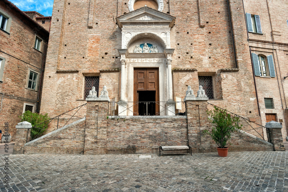 brick façade of the church of san domenico in urbino, built in 1365.