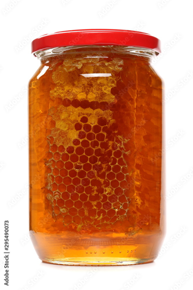 Jar of honey with honeycomb isolated on white background Jar of honey with honeycomb isolated on white background