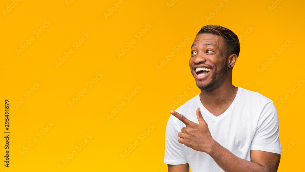 Excited Afro Man Pointing Finger Aside, Studio Shot, Panorama - obrazy, fototapety, plakaty 