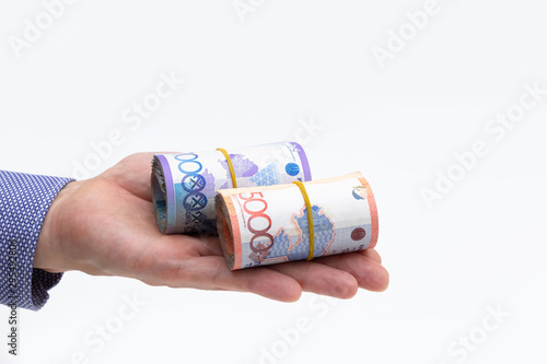 Rolls of tenge banknotes photo