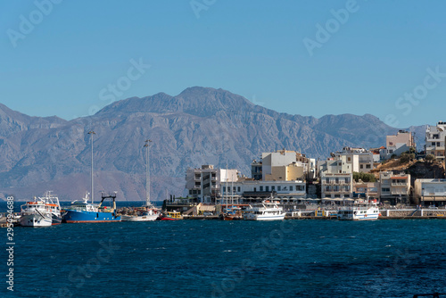Agios Nikolaos, Crete, Greece. October 2019. The waterfront of this attractive town on the Gulf of Mirabello. popular with visiting holidaymakers.