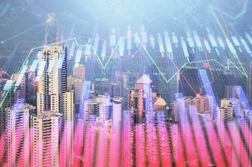 Forex graph on city view with skyscrapers background multi exposure. Financial analysis concept.