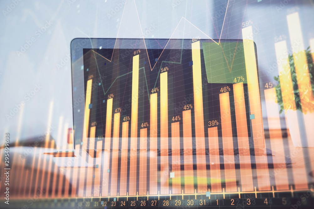 Stock market graph and table with computer background. Double exposure. Concept of financial analysis. Stock market graph and table with computer background. Double exposure. Concept of financial analysis.