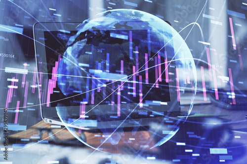 Financial graph colorful drawing and table with computer on background. Double exposure. Concept of international markets.